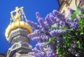 Lilac flowers and golden church cupolas