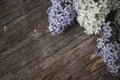 Lilac flowers on wood background, blossom branch on vintage wooden texture Royalty Free Stock Photo