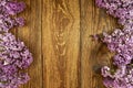 Lilac flowers on a wooden background, frame