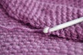 Lilac knitted round carpet or rug.