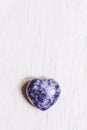 Lilac lepidolite stone heart on white background Royalty Free Stock Photo