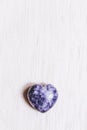 Lilac lepidolite stone heart on white background Royalty Free Stock Photo