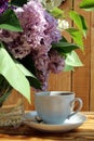 Cup of morning tea on a lilac background under the sun Royalty Free Stock Photo