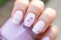 lilac nail polish with spring butterfly decals applied