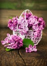 Lilac in openwork metal basket