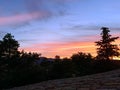 Lilac-orange sunset over the old tiled roof in Mirmande village Royalty Free Stock Photo