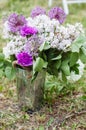 Lilac Peonies, Giant Onions, and Carnations Adorn a Decorative Basket, Adding Floral Charm to Events and Weddings