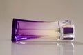 Lilac perfume bottle laying Royalty Free Stock Photo