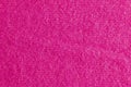 Lilac-pink knitted carpet close-up. Textile texture on a lilac-pink background. Detailed warm yarn background. Natural wool fabric Royalty Free Stock Photo