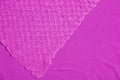 Lilac-pink knitted carpet close-up. Textile texture on a lilac-pink background. Detailed warm yarn background. Natural wool fabric Royalty Free Stock Photo