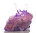 Lilac polyethylene bag with handles, filled with garbage isolate