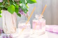 lilac refreshing drink Fresh non alcoholic cocktail in glass with lilac flowers on white background Royalty Free Stock Photo