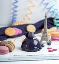 Lilac round cake with macarons on a white wooden board, Royalty Free Stock Photo