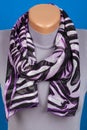 Lilac scarf on mannequin isolated on blue background