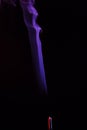 Lilac smoke incense sticks on a black background Royalty Free Stock Photo