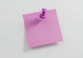 Lilac Sticky Note Pinned on White Wall for Reminders and Organization Blank Paper for Messages and Announcements Royalty Free Stock Photo