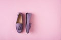Lilac suede moccasins shoes over lilac pink background