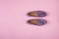 Lilac suede moccasins shoes over lilac pink background