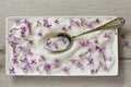 Lilac Sugar In Spoon On WoodenTable