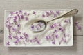 Lilac Sugar In Spoon On WoodenTable