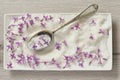 Lilac Sugar In Spoon On WoodenTable