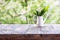 Lilies of the valley on a wooden board