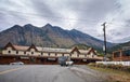 Lillooet, BC, Canada - October 2, 2019. Wooden Reynolds Hotel on the background of the Coast Mountain Range