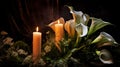 Lilly and burning candels in darkness Royalty Free Stock Photo
