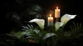 Lilly and burning candels in darkness Royalty Free Stock Photo