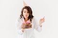 a lilt woman with a birthday cake with candles.