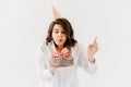 a lilt woman with a birthday cake with candles.