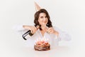 a lilt woman with champagne and a birthday cake with candles. Royalty Free Stock Photo