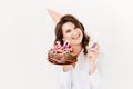 a lilt woman with a glass of champagne and a birthday cake with candles. Royalty Free Stock Photo