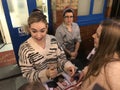 Lily James signing autuographs outside The Noel Coward Theatre following her performance in All About Eve.