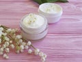 Lily of the valley flower therapy shower products cosmetic on pink wooden Royalty Free Stock Photo