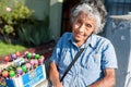 LIMA, PERU - APRIL 12, 2013: An unidentified Peruvian woman selling Chupa Chups sweets on the street. Closeup face