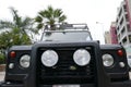 Black Land Rover Defender with white top in Lima