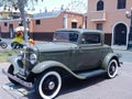 Green Ford De Luxe coupe two doors showed in Lima Royalty Free Stock Photo