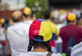 Woman wearing Venezuelan flag cap at protest