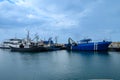 LIMASSOL, CYPRUS - APRIL 15, 2024: Old port of Limassol with beautiful fishing boats at sunset Royalty Free Stock Photo