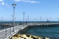 Sea pier with fishing men