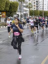 Woman running in Limassol Marathon Corporate race, Cyprus