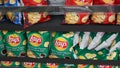 Limassol, Cyprus - 12.10.2022: A shelf with many packs of Lays Chips, Salted