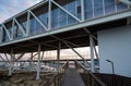 Limassol, Cyprus - Wooden and metal construction of a contemporary pedestrian bridge and restaurant at the old harbour