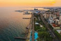 Limassol promenade at sunset, Cyprus. Aerial panoramic view of evening Limassol with Molos Park from above, drone photo