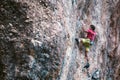 Climber overcomes a difficult climbing route on a natural terrain Royalty Free Stock Photo