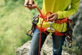 ÃÂ¡limber wearing safety harness making a eight rope knot Royalty Free Stock Photo