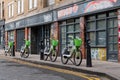 Lime bikes parked on a street in East London, UK Royalty Free Stock Photo