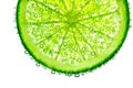 Lime with bubbles in water isolated on white background Royalty Free Stock Photo