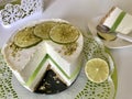 Lime cheesecake without baking. Decorated with lime slices. The piece is cut off. Lies on a plate Royalty Free Stock Photo